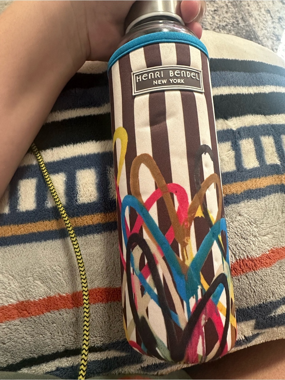 henri bendel Brown & Blue Striped Bottle Sleeve with Multicolor Heart Scribbles